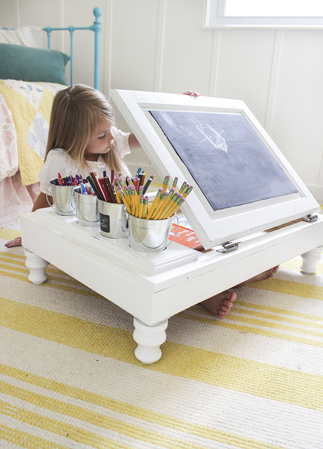A discarded kitchen cabinet turned into a child's craft desk