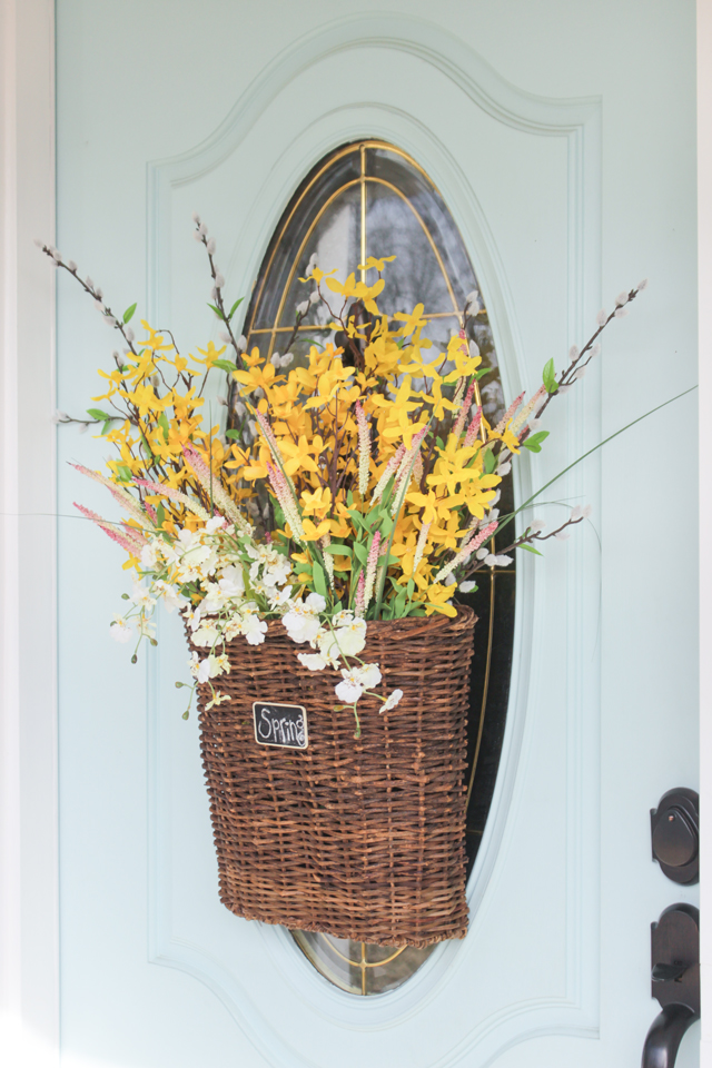 Spring Hanging Basket with forsythia on aqua door