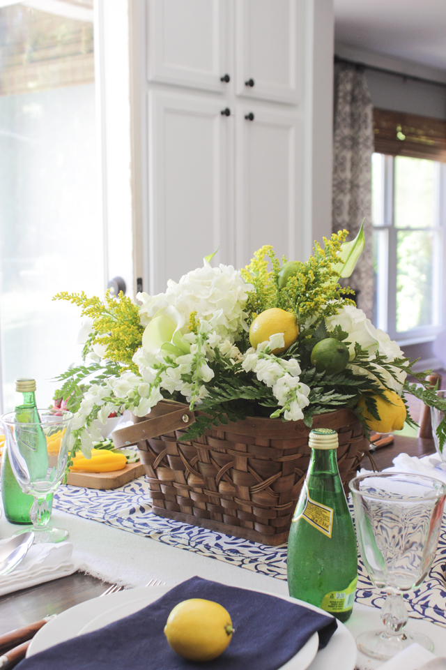 Summer floral arrangement with lemons and limes