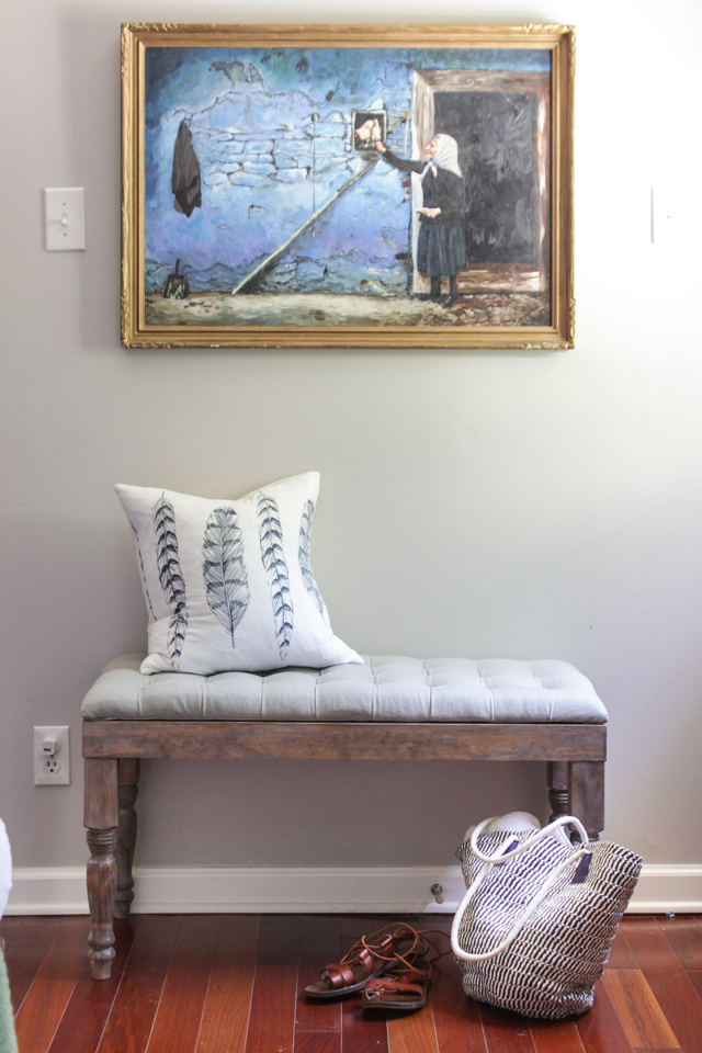Oil painting over tufted bench