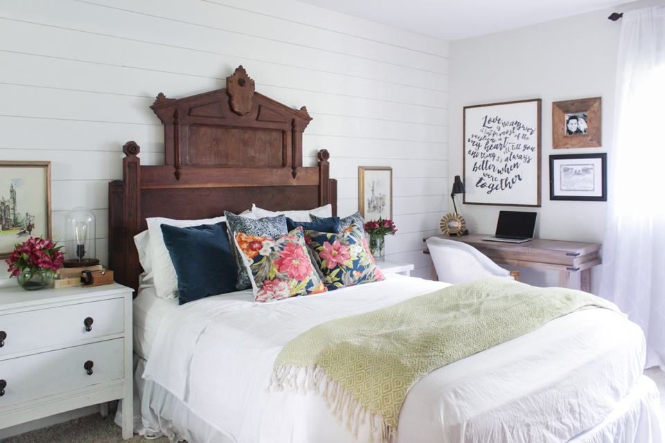 Master bedroom with Eastlake vintage headboard, floral pillows and desk