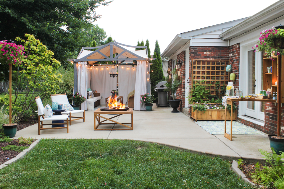 Patio with pergola, grill, seating area, fire pit, murphy bar, and planter with trellis