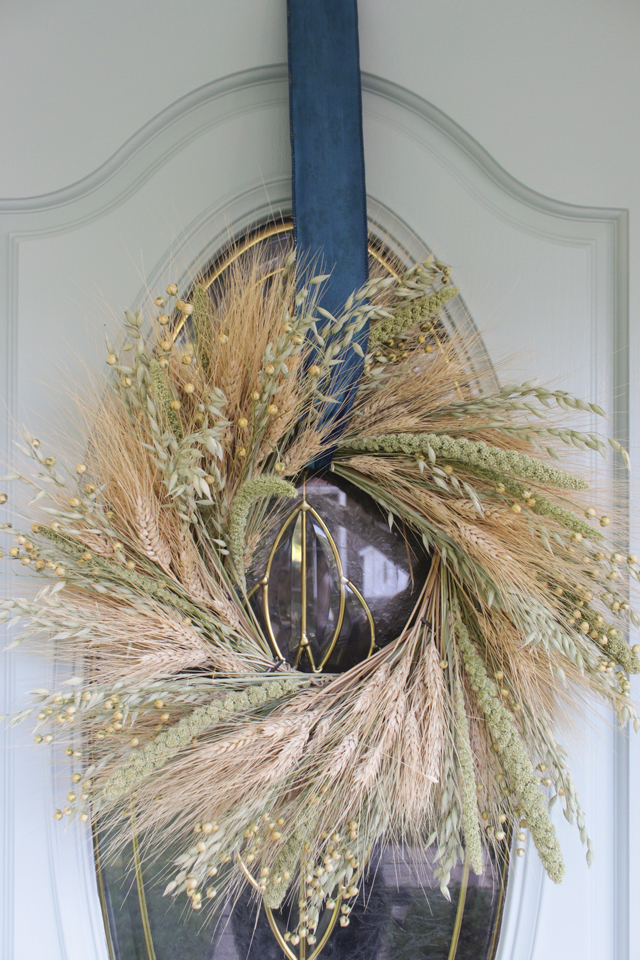 Wheat wreath for fall on an aqua front door