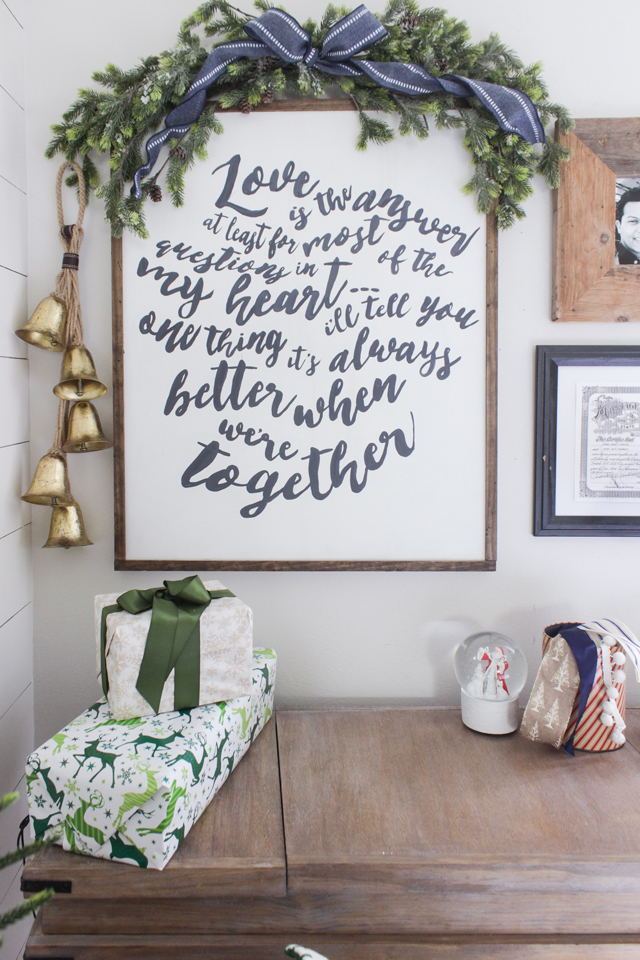 DIY word art with a garland on top and a gold bells- Christmas Decor for a Gallery Wall