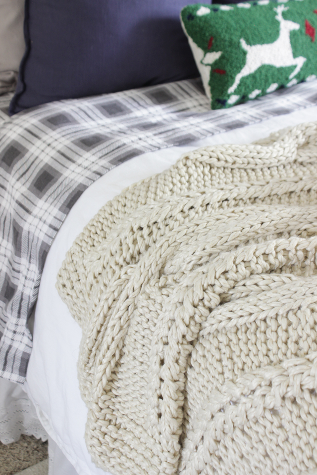 Cable knit wool throw for cozy textures on a bed