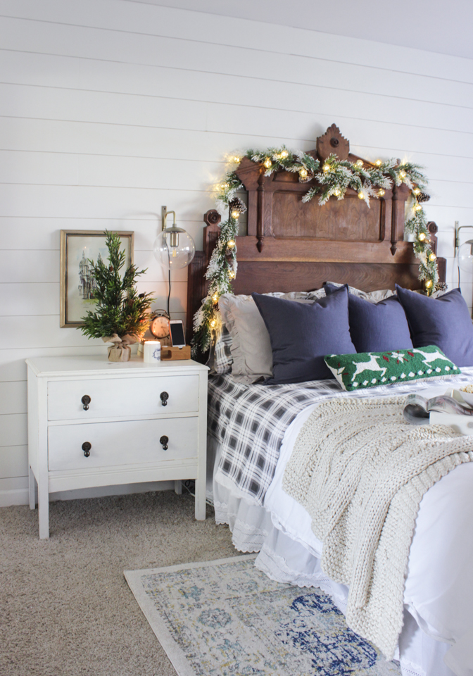Rustic Christmas master bedroom with garlands for a cabin feel