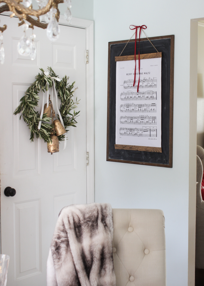 Fresh olive wreath and a Christmas Hymn wall hanging