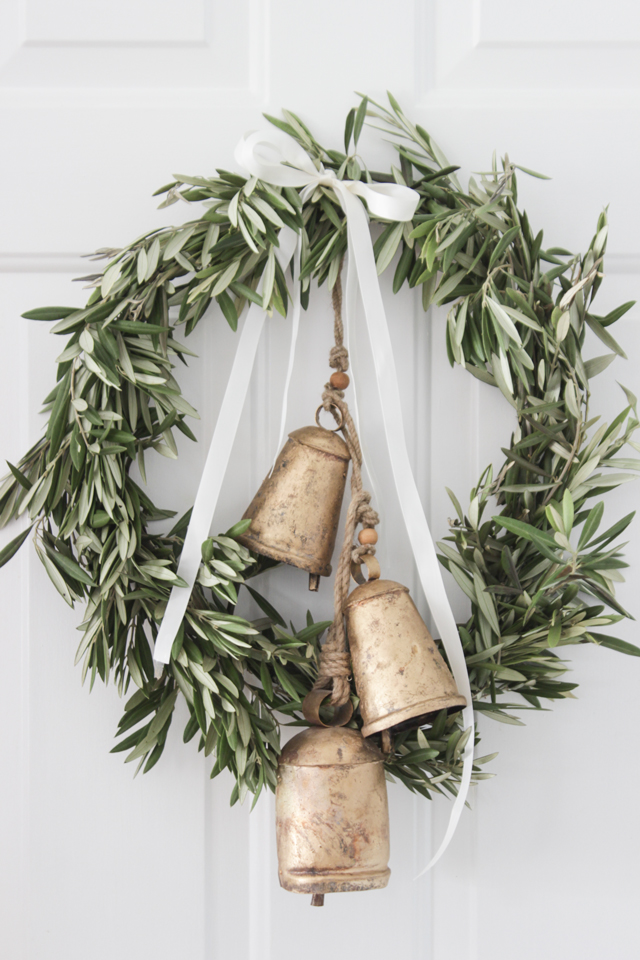 Fresh olive branch wreath with gold bells