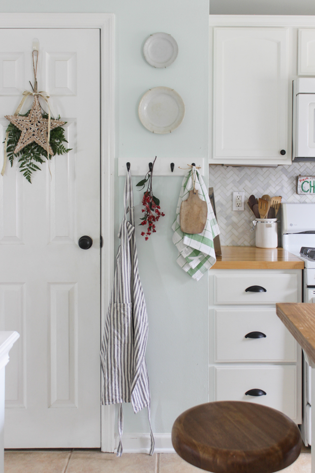 Christmas star on pantry door and kitchen hooks