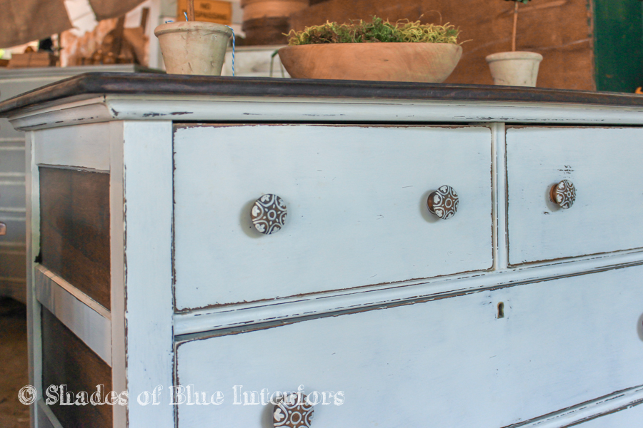 White two tone dresser with hand-painted wooden knobs