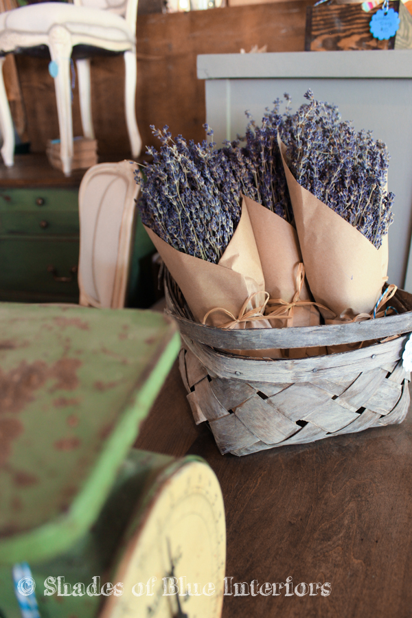 Dried lavender in a basket next to a green kitchen scale