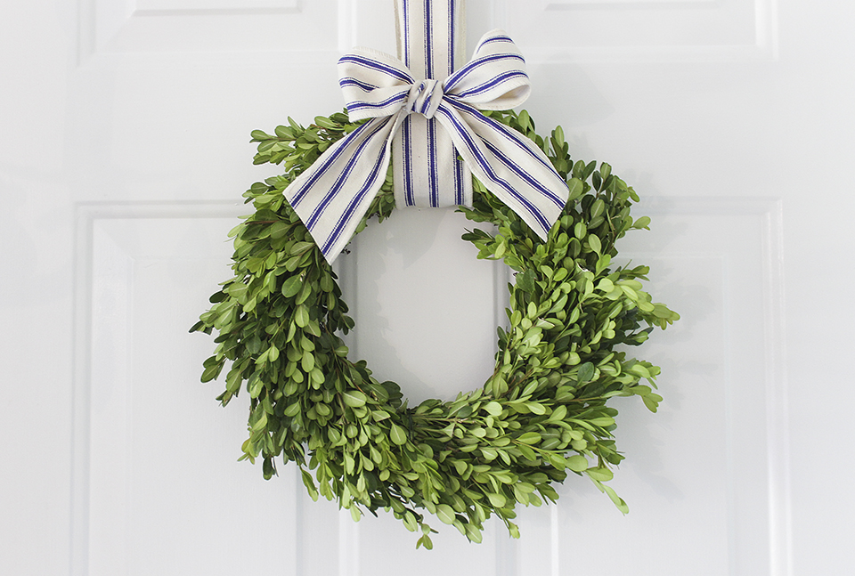 Boxwood wreath with striped ribbon