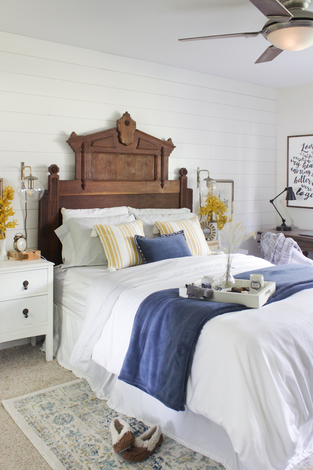 Fall bedroom with statement headboard, blue and yellow accent colors