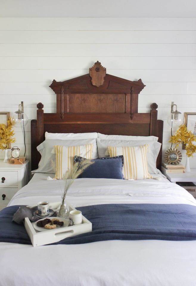 Fall bedroom with statement headboard, blue and yellow accent colors