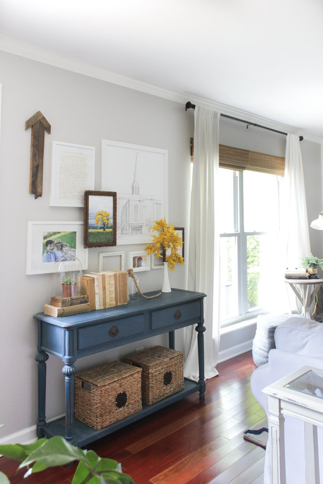 Fall family room tour with layered gallery wall over blue console table