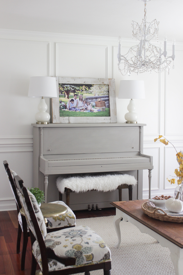 Painted gray vintage piano in formal front room