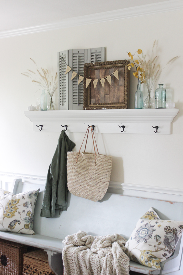 Fall Entry shelf with aqua church pew bench and cozy cable knit blanket