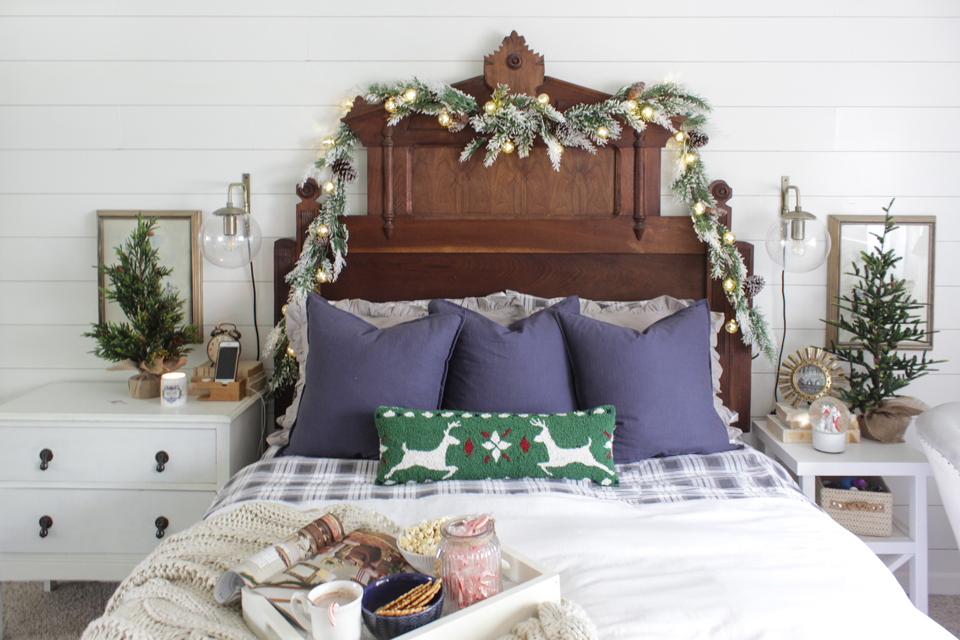 Rustic Christmas master bedroom with garlands for a cabin feel